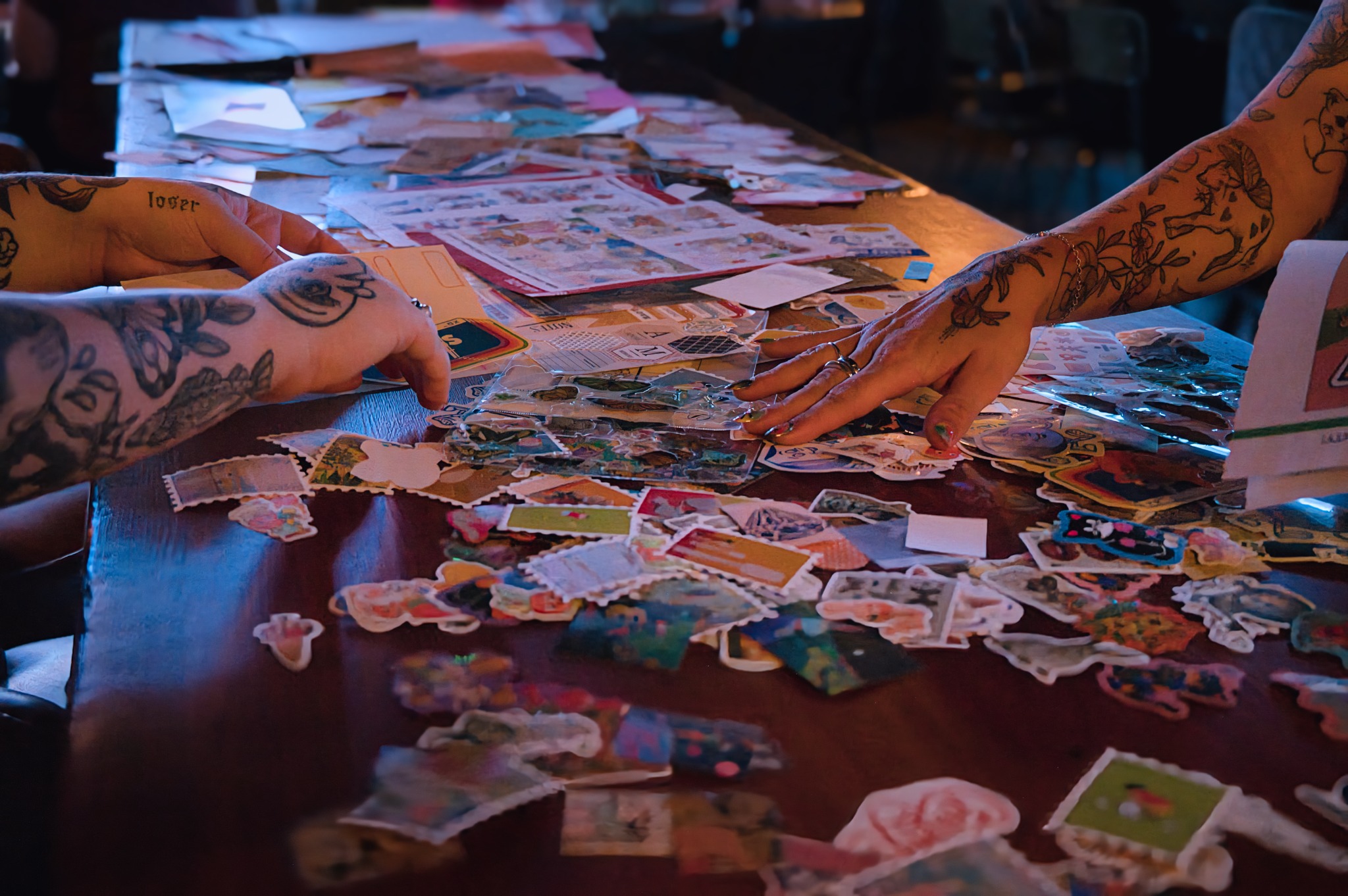 People making colourful collage art together