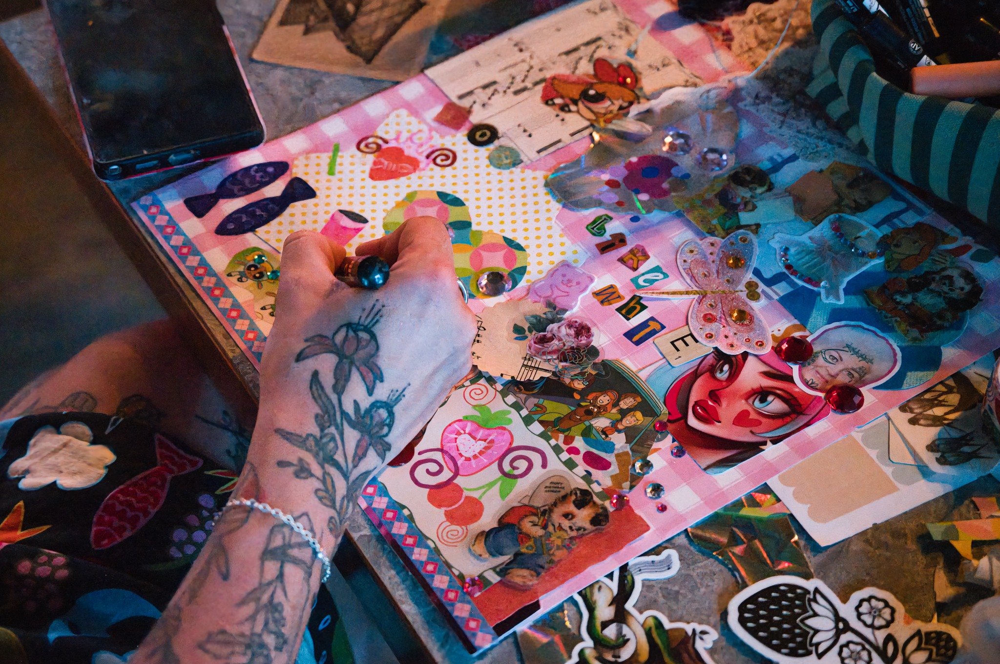 Creative work spread across a workshop table